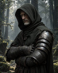 GRID THUMBNAIL — A grey-bearded man in a dark hood and ornate armour stands with arms crossed in a misty forest, lit by soft daylight.