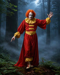 GRID THUMBNAIL — Sinister clown in red and yellow costume with white face paint and orange hair, gesturing in a foggy moonlit forest amid towering trees.